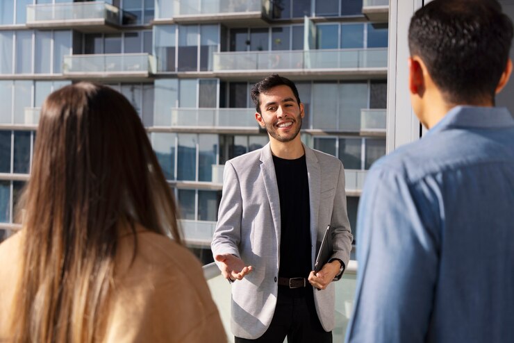 medium-shot-couple-talking-real-estate-agent_23-2150322087