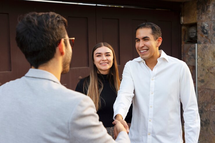 medium-shot-couple-talking-real-estate-agent_23-2150322110